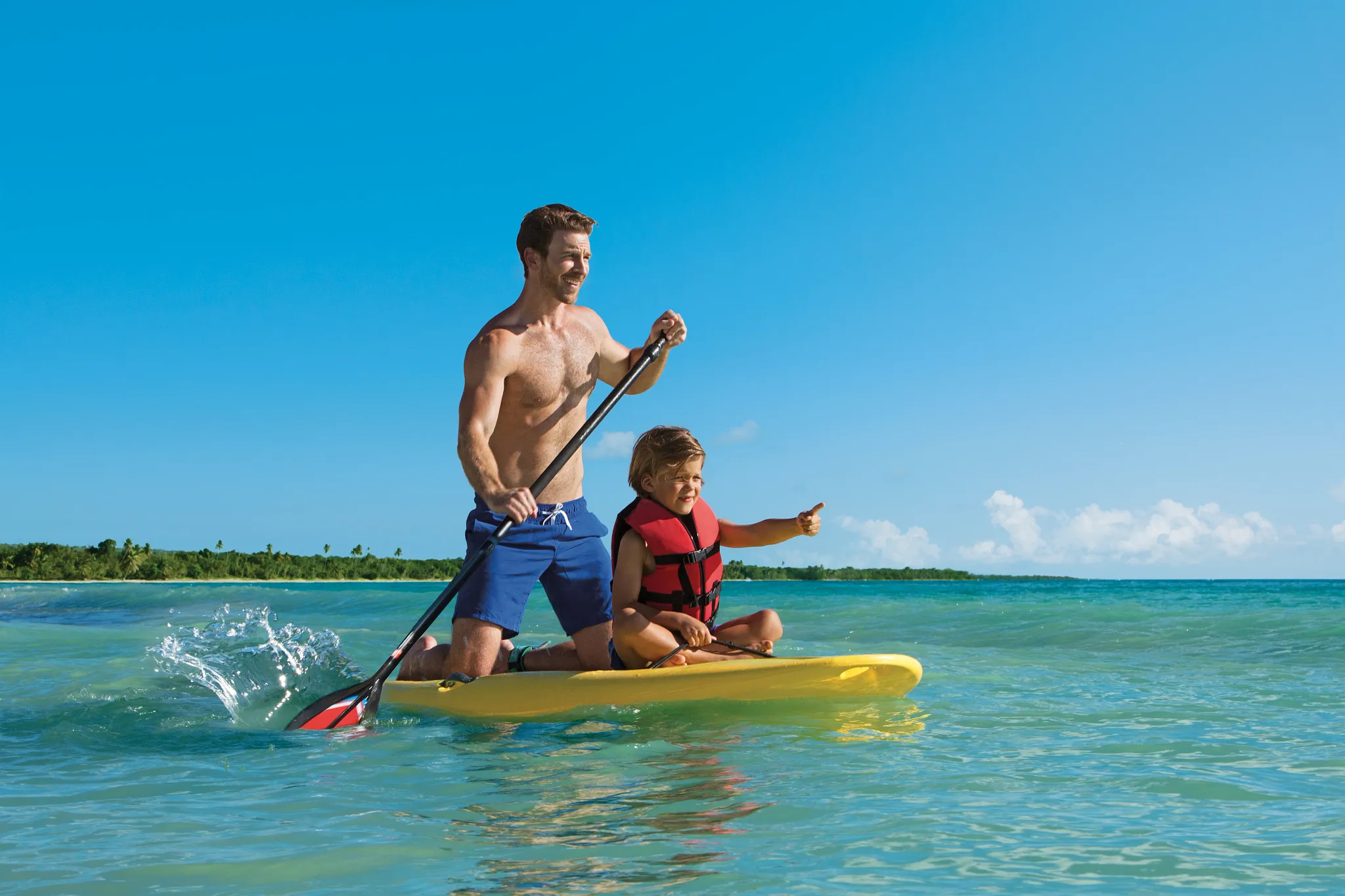 Father and Son on Paddle Board